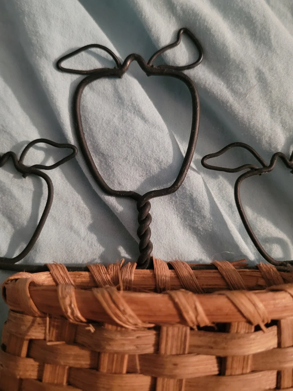 Rustic Black Metal Apple Wall Hook with Woven Basket Accent